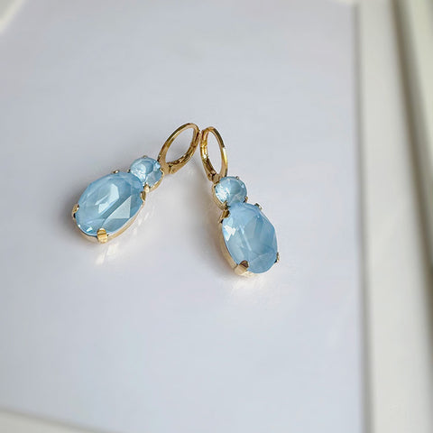Earrings with light blue round and oval crystals