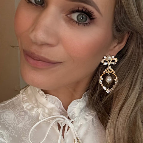 Charmante Statement-oorbellen met strikje en parels