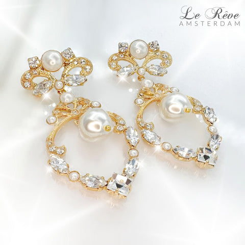 Charmante Statement-oorbellen met strikje en parels